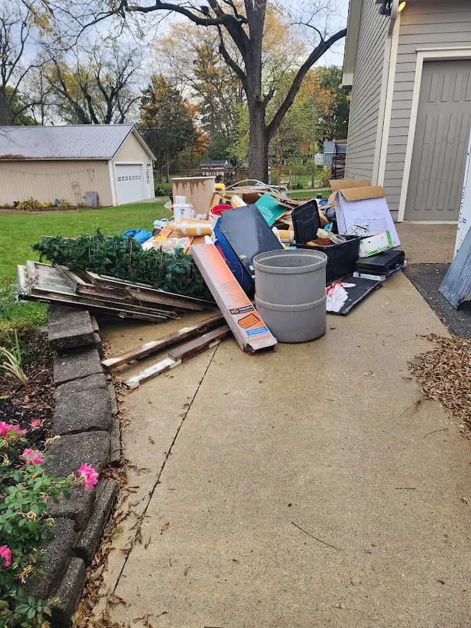Dumpster being loaded with debris for Demolition Dumpster Rental in West Lafayette